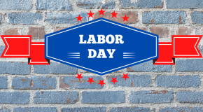 brick wall with words "labor day" in overlying banner