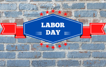 brick wall with words "labor day" in overlying banner